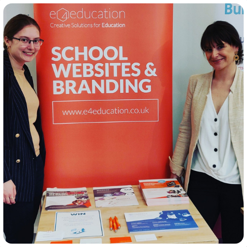 Katie and Natalie with e4education stand
