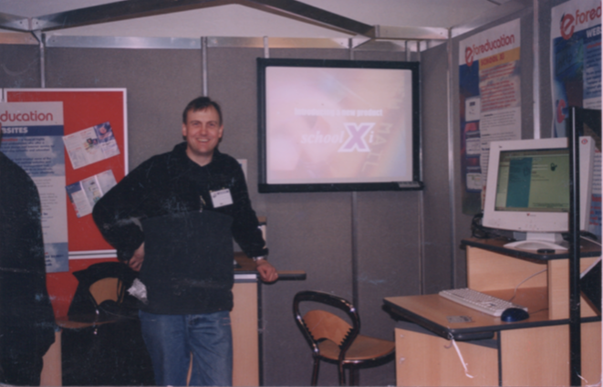 CEO John Roach on the BETT stand in 2002