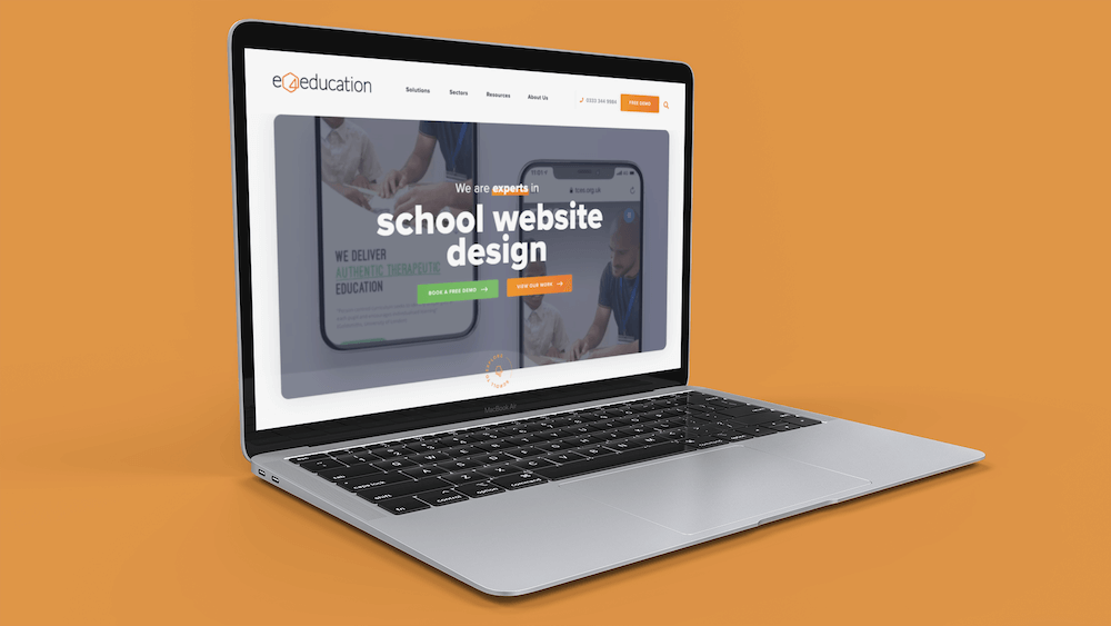 new e4education website on a laptop on an orange background